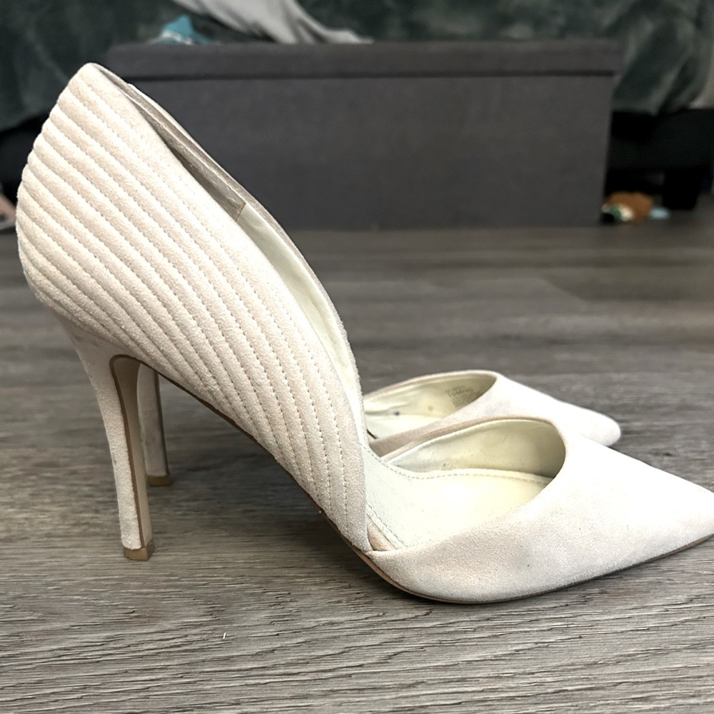Size 10 creamy white suede BCBG heels. Gently used, still in good condition!